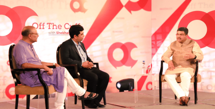 Three people sitting on OTC stage