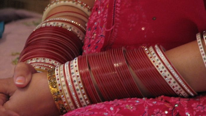 A woman's hand with bangles