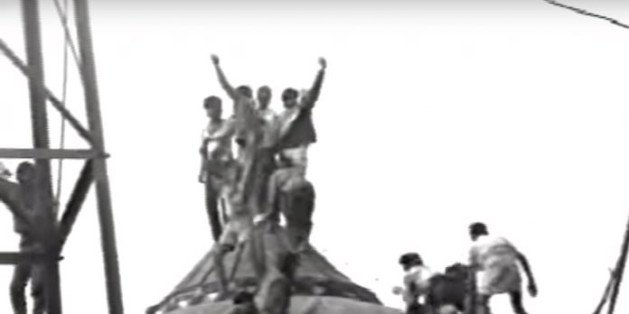 Kar sewaks atop the Babri Masjid