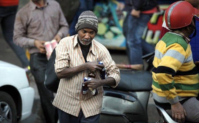 A man carrying bottles of liquor