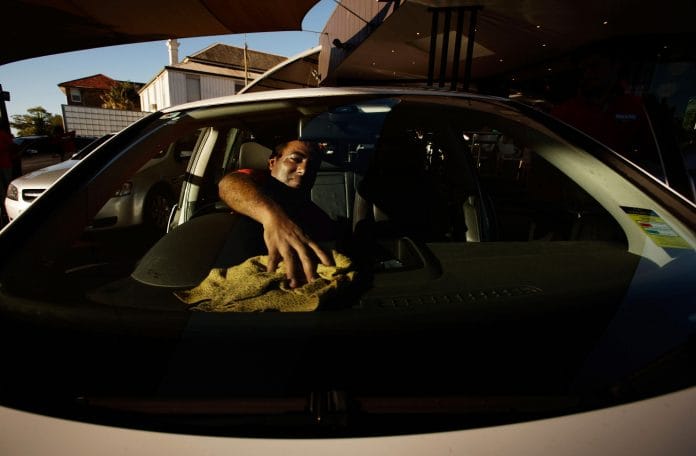 Man cleaning his car