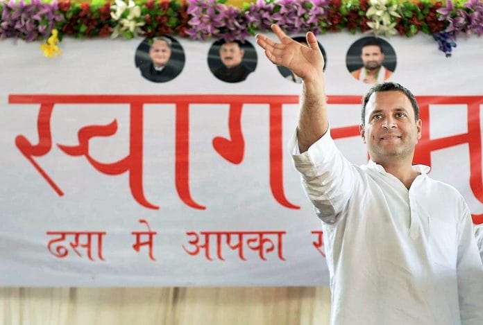 Congress vice president Rahul Gandhi waves to supporters during his election rally in Dhasa, Gujarat.