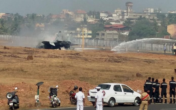 Fire fighter try to douse a crashed MiG-29 K fighter