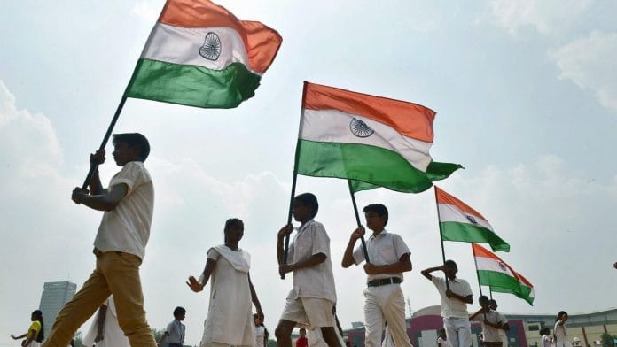 School children carrying Indian flags