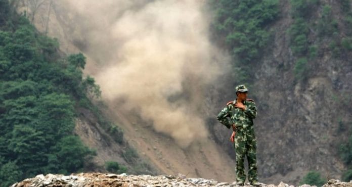 A Chinese soldier on a mountain