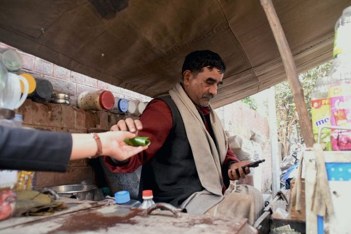 Balbir Chaurasia using his smartphone