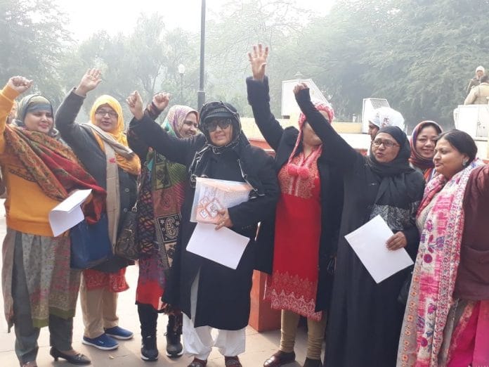 Members of Muslim Rashtriya Manch celebrate.