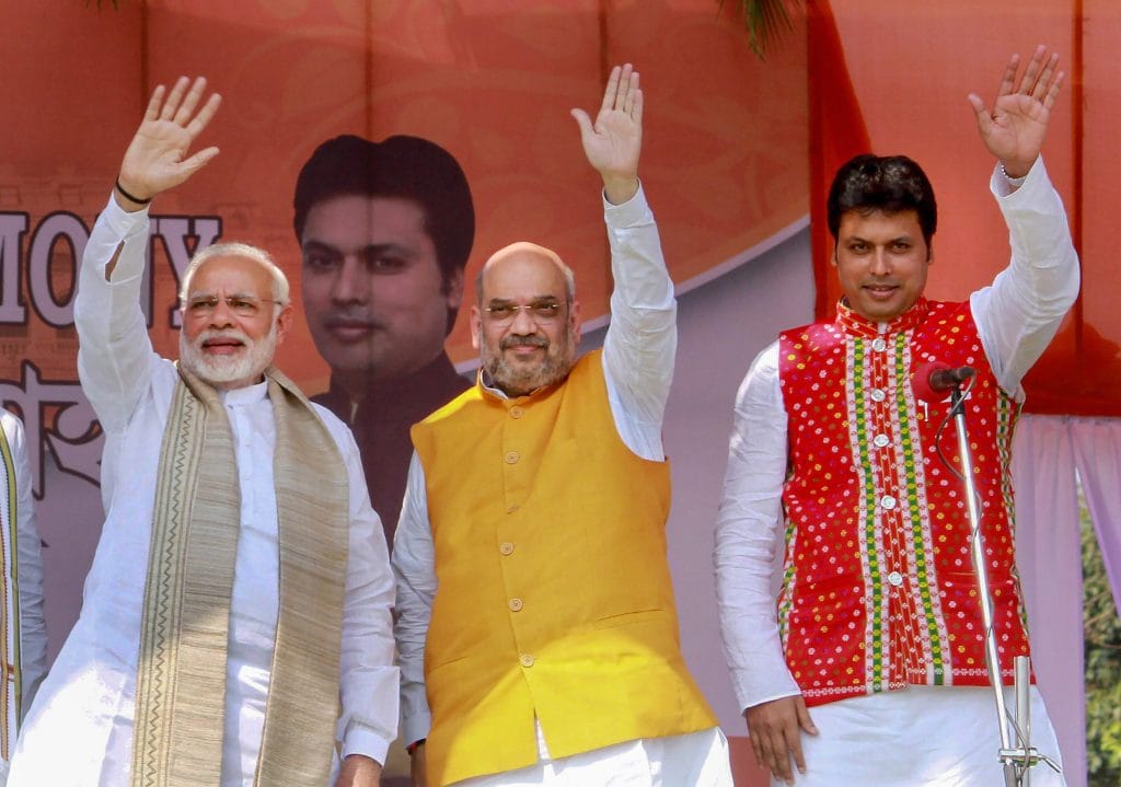 Narendra Modi with Bharatiya Janata Party (BJP) National President Amit Shah, new Tripura Chief Minister Biplab Kumar Deb during the swearing-in ceremony | PTI