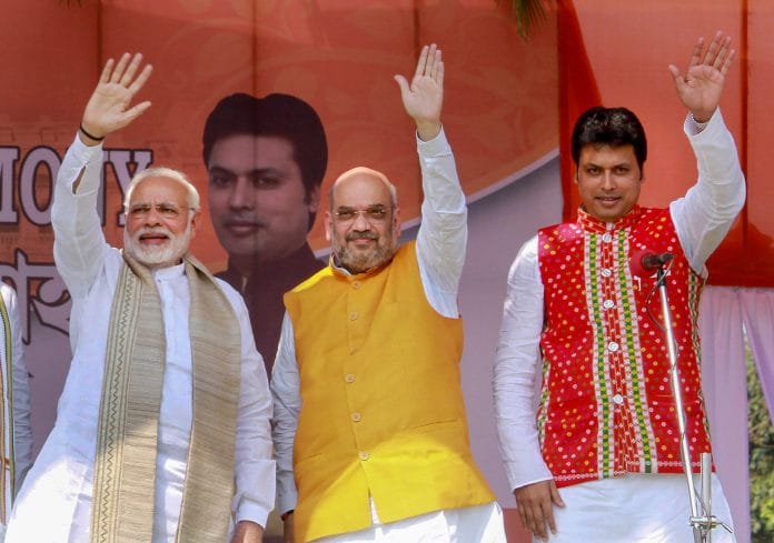 Narendra Modi with Bharatiya Janata Party (BJP) National President Amit Shah with former Tripura Chief Minister Biplab Kumar Deb | PTI