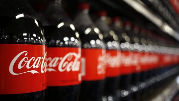 Bottles of Coca-Cola displayed for sale