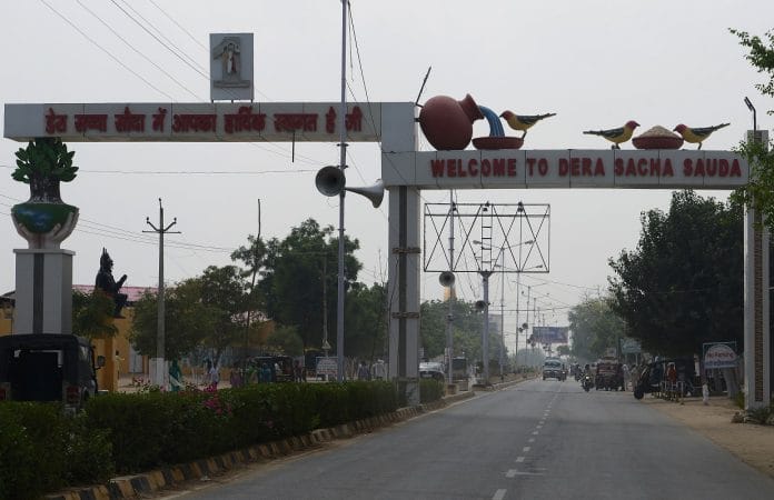 A welcome sign of the 'Dera Sacha Sauda' ashram of Ram Rahim in Sirsa