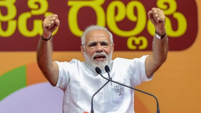 Narendra Modi addressing a public rally during Karnataka assembly elections, in Bengaluru