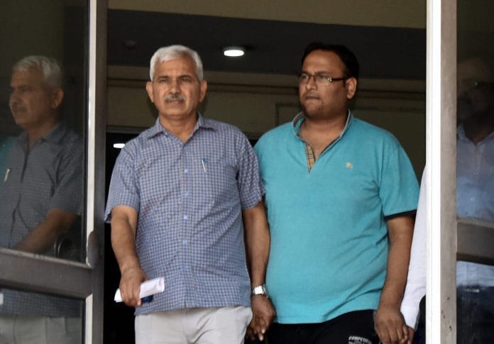 Anti-Corruption Bureau (ACB) produces Vinay Bansal (R) in a court | PTI