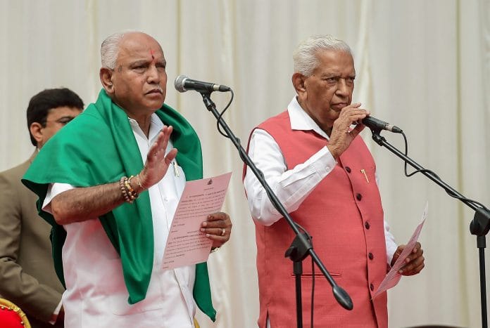 Karnataka Governor Vajubhai Vala administers oath to Bharatiya Janata Party (BJP) leader B. S. Yeddyurappa as Chief Minister of the state