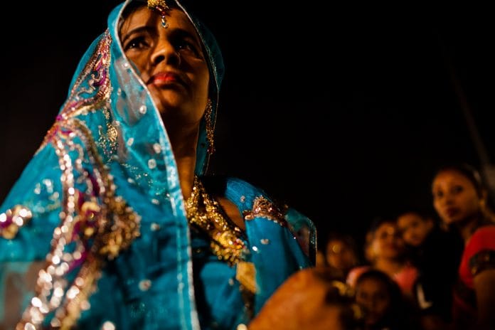 A woman during a wedding procession in New Delhi | Daniel Berehulak/Getty Images