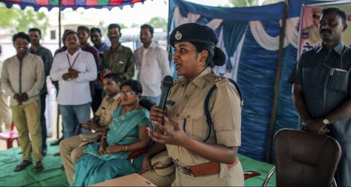 IPS Officer Rema Rajeshwari addresses villagers at a public awareness programme for fake news via social media apps in Balgera village