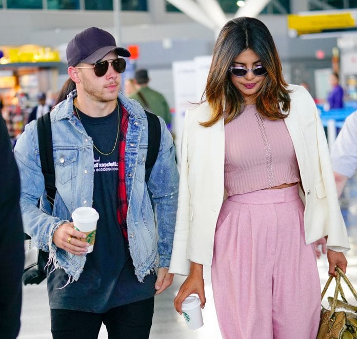 Nick Jonas and Priyanka Chopra at JFK airport earlier this month | Gotham/Getty Images