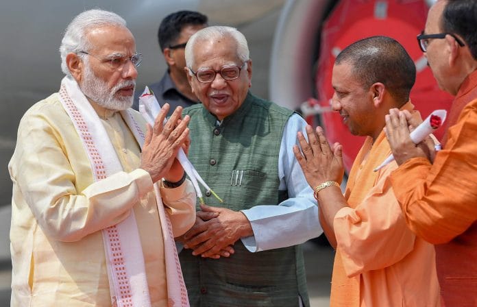 PM Narendra Modi being greeted by Uttar Pradesh CM Yogi Adityanath and Governor Ram Naik on his arrival in Varanas