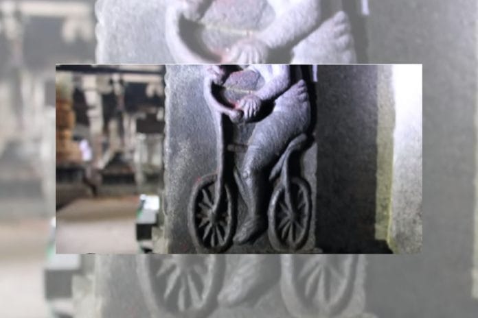 The inscription of a man on a bicycle