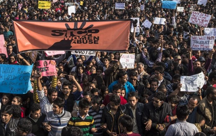 Students hold up placards during a protest against the rape in New Delhi, 2012 | Daniel Berehulak/Getty Images