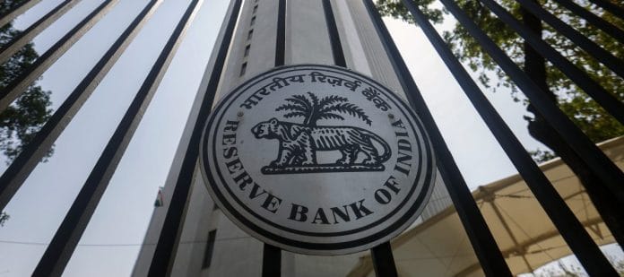 RBI logo displayed outside its headquarters in Mumbai | Adeel Halim/Bloomberg