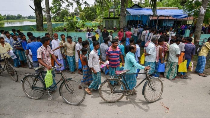 File photo: People wait to check their names on the final draft of Assam's NRC after it was released, at a NRC Seva Kendra in Nagaon in July 30, 2018. | PTI Photo