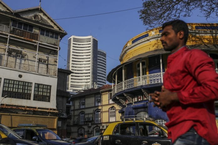 Pedestrians walk past the Bombay Stock Exchange (BSE) building | Dhiraj Singh/Bloomberg
