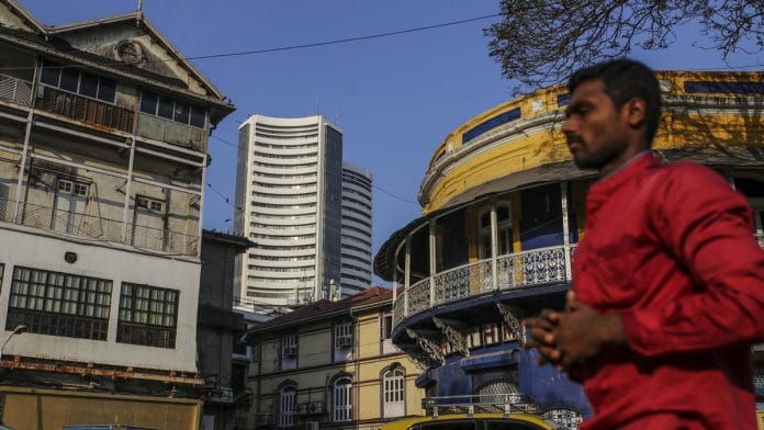 Pedestrians walk past the Bombay Stock Exchange (BSE) building | Dhiraj Singh/Bloomberg