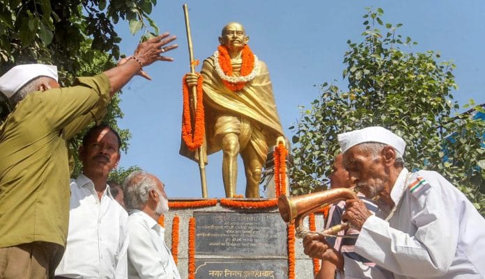 People pay tribute to Mahatma Gandhi on his 149th birth anniversary, in Allahabad, Tuesday