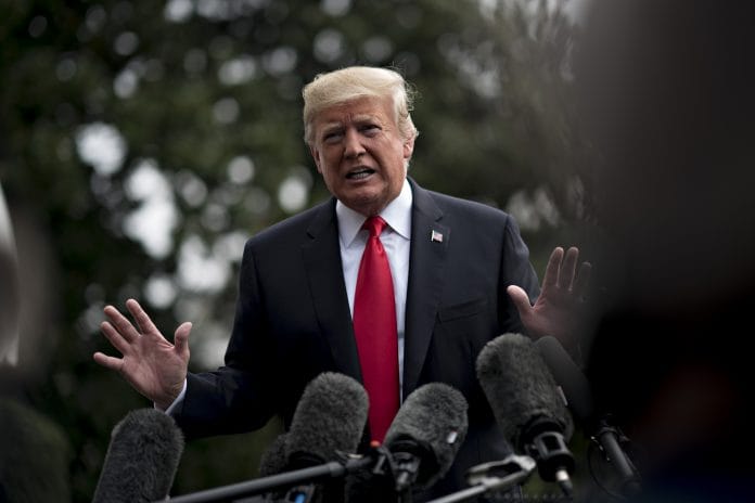 U.S. President Donald Trump speaks to members of the media | Andrew Harrer/Bloomberg