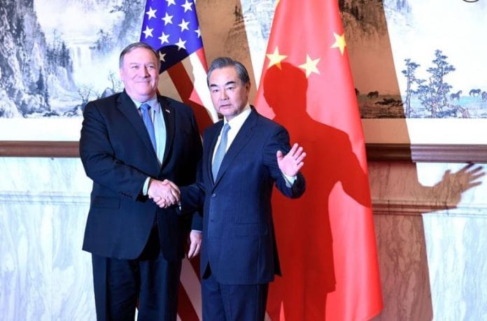 Mike Pompeo and Wang Yi in Beijing | Bloomberg