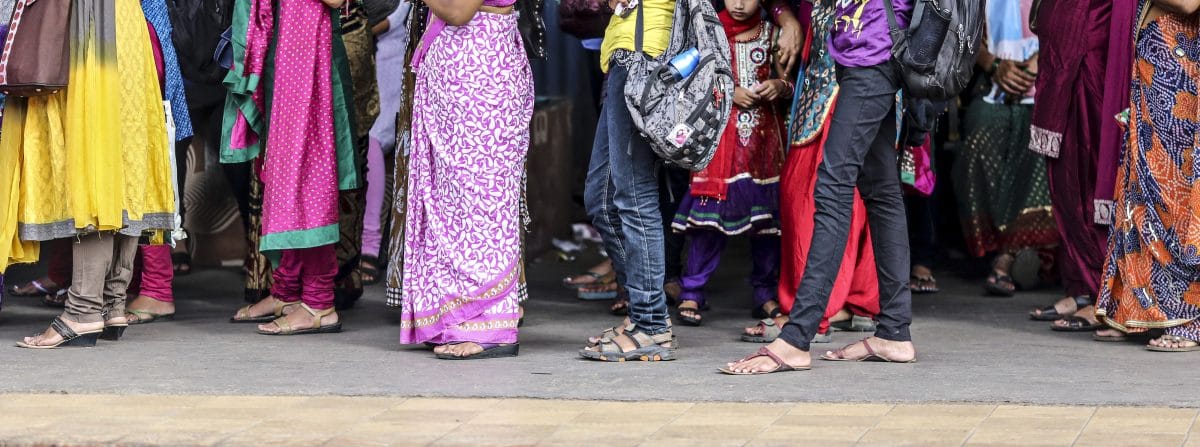 Women during the morning commute | Dhiraj Singh/Bloomberg