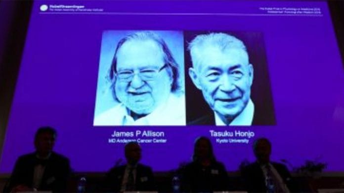 The scientists' images displayed on a screen | Jonathan Nackstrand/AFP/Getty Images