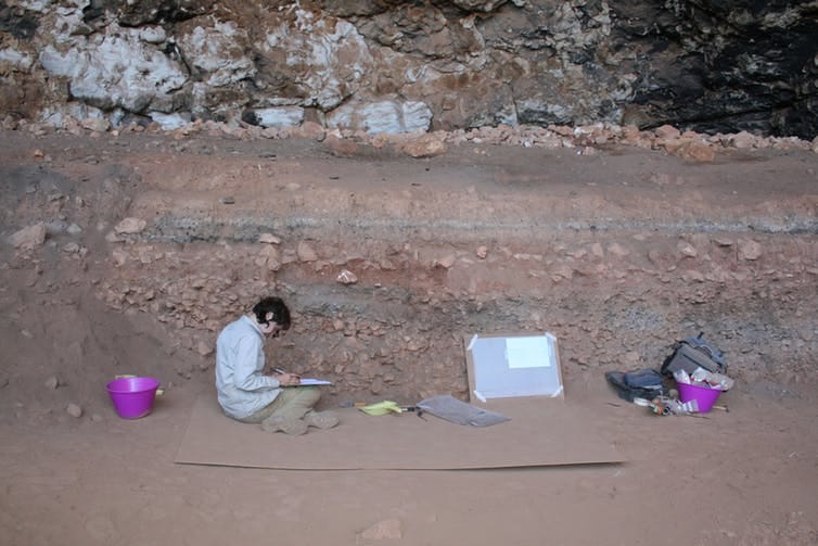 Amy Prendergast excavating a shell rich layer from the archaeological site of Haua Fteah | Giulio Lucarini, University of Cambridge