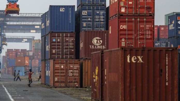 Shipping containers sit stacked at the Jawaharlal Nehru Port