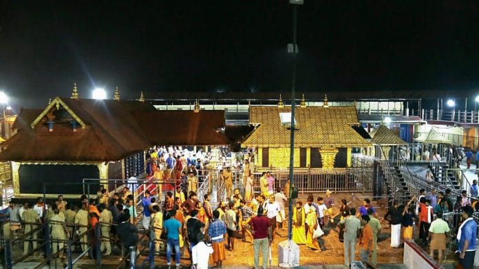 Devotees pray at the Sabarimala temple