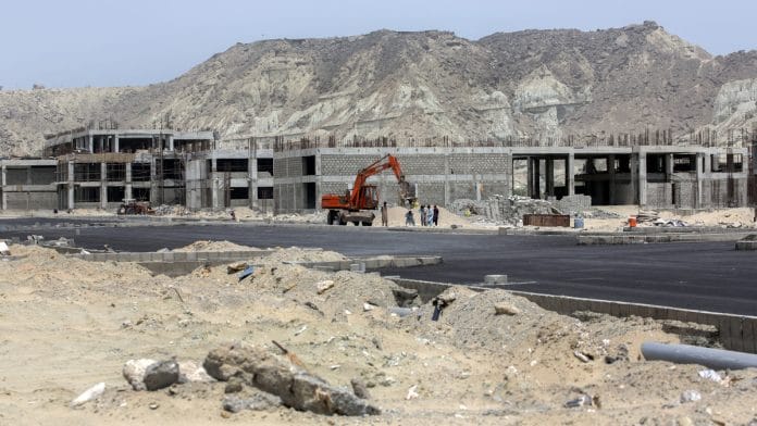 Buildings stand under construction at a development site, operated by China Overseas Ports Holding Co., near Gwadar Port in Gwadar, Balochistan, Pakistan | Photographer: Asim Hafeez/Bloomberg