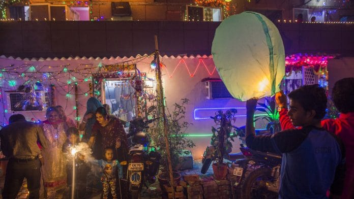 People gather during Diwali celebrations in Delhi | Prashanth Vishwanathan/Bloomberg