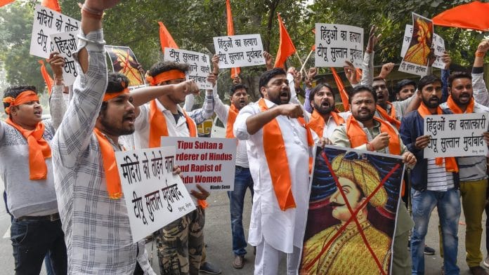 Hindu Sena activists burn an effigy of Tipu Sultan during a protest over the celebration of 'Tipu Jayanti' at Jantar Mantar in New Delhi | Atul Yadav/PTI