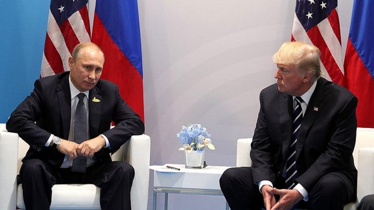 Putin smiles as Trump tells him not to meddle in upcoming US elections at G20 summit