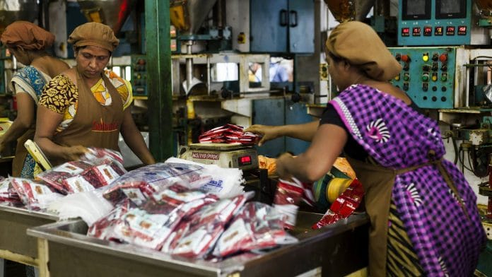 Workers at a spice factory in Pune