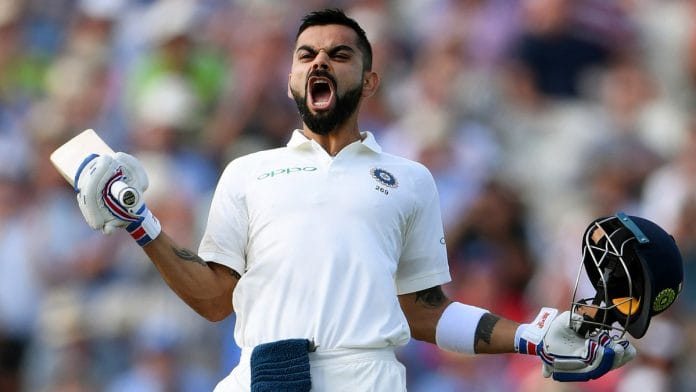 India batsman Virat Kohli celebrates his century during the Test Match between England and India at Edgbaston | Stu Forster/Getty Images