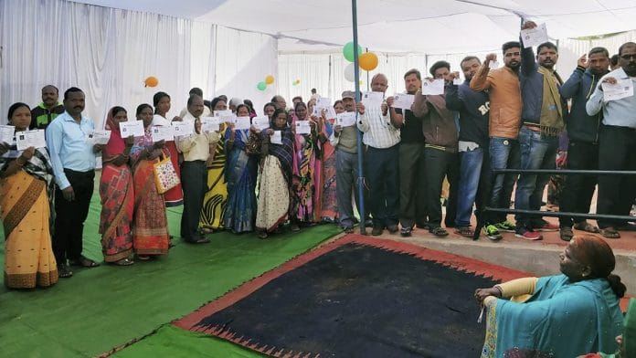 Voters stand in a queue at a polling station in Jashpur district of Chhattisgarh | PTI