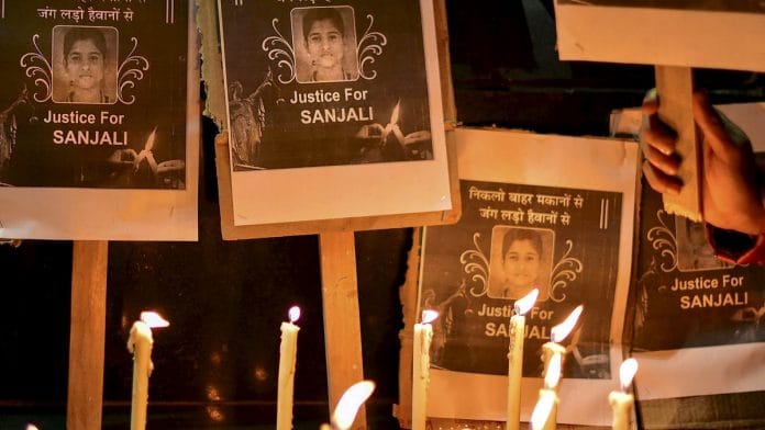 People take part in a candle light march demanding justice for Sanjali Chanakya