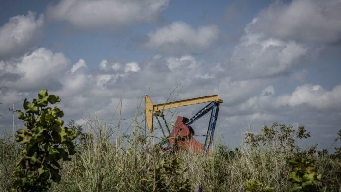 A pump jack stands at a PDVSA facility in El Tigre, Venezuela