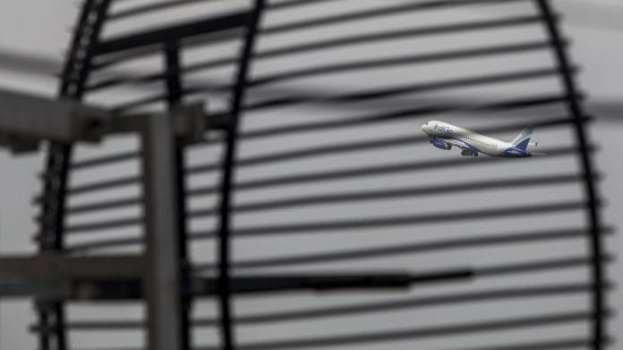 An aircraft takes off at Indira Gandhi International Airport in Delhi | Prashanth Vishwanathan/Bloomberg