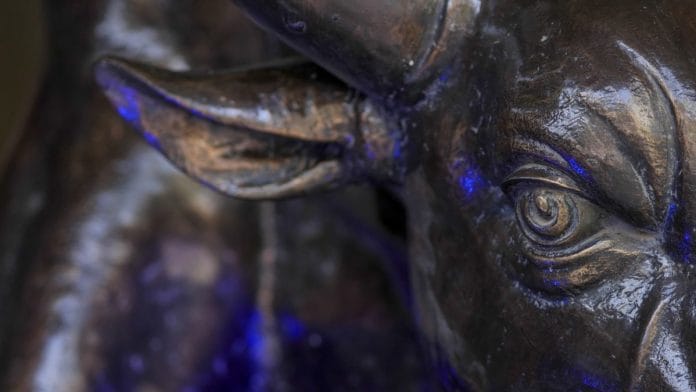 A bronze bull statue at the entrance to Bombay Stock Exchange | Dhiraj Singh/Bloomberg