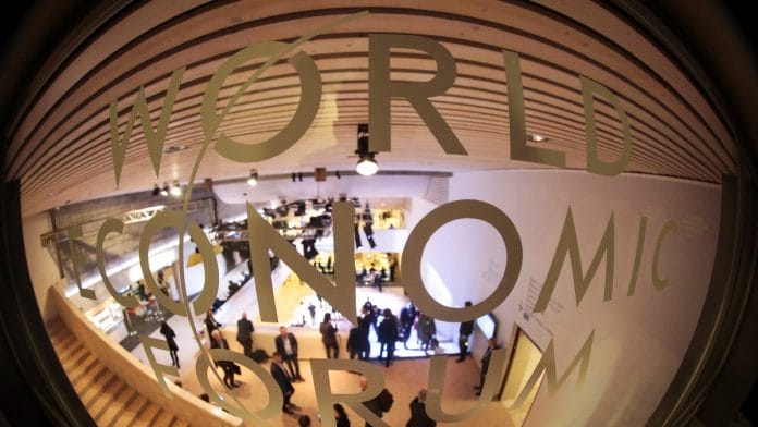A logo sits on display inside the Congress Center in Davos | Jason Alden/Bloomberg