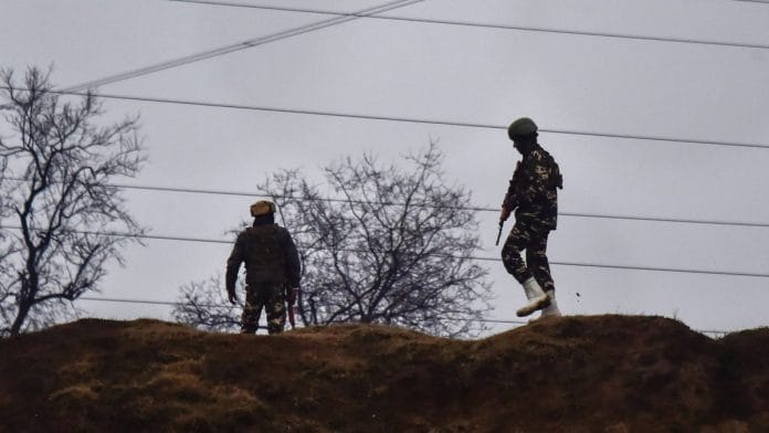 Army soldiers guard near the site of suicide bomb attack at Lathepora Awantipora in Pulwama
