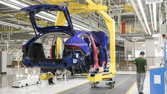 A Jaguar E-Pace compact sport utility vehicle (SUV) moves along a conveyor on the production line at the second phase of the Chery Jaguar Land Rover Automotive Co. plant in Changshu, China| Qilai Shen/Bloomberg